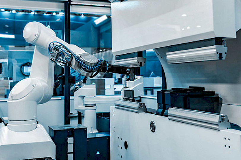 White industrial robot in a machine building plant.