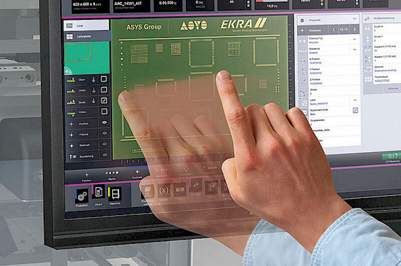 Human hand over a monitor displaying a PCB board.