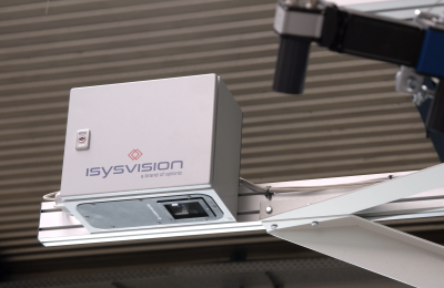 Human hand over a monitor displaying a PCB board.