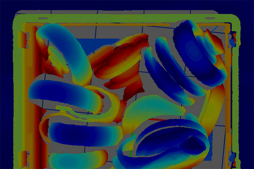 Thermal image of components lying in a box.