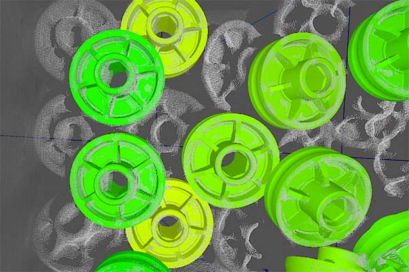 Monochrome image of superimposed gears. Twelve gears are colored green.